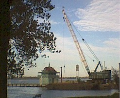 A Crane Unloading a Barge