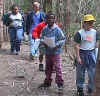 Elementary students walking through the woods